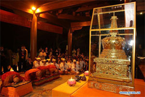 Buddha's tooth is preserved in a small gold pagoda in the middle of the hall. 
