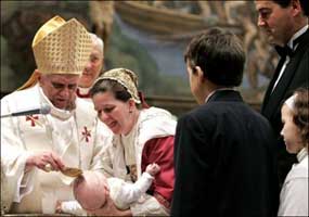 Pope Benedict XVI baptizing an infant. 