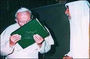 Pope John Paul II kisses the Koran during a meeting with Moslems at the Vatican. 