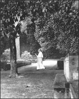 Very fit Pope Pius XII walking briskly in the gardens. 