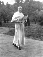 Pope Pius XII taking a brisk walk in the gardens of Castel Gondolfo, Oct. 1958.
